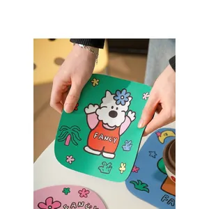 Close-up of soft colorful diatom mud coasters with cartoon dog patterns and Fancy text