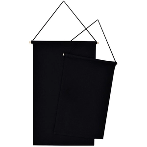 Detail of two black canvas banners for pin display hanging from natural wooden poles