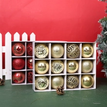 Detailed view of red and gold Christmas ornaments with glitter and matte finishes