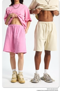 Detail of heavyweight 420g washed cotton fabric and drawstring on pink street shorts
