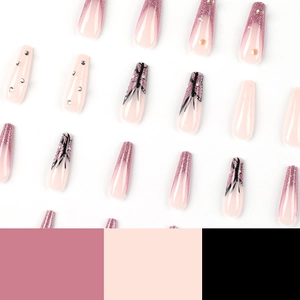 Pink gradient press-on nails with glitter French tips, rhinestones and butterfly patterns