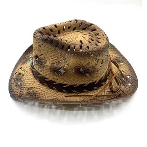 Detail of vintage Western straw hat with hollow weave and turquoise bead belt