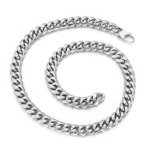 Polished silver stainless steel Cuban link chain necklace with lobster clasp on white background