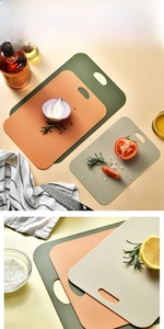 Detailed view of 3-piece thin cutting board set with non-slip texture and handle