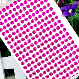 Macro shot of 3mm bright pink faceted acrylic rhinestones for DIY crafts decoration