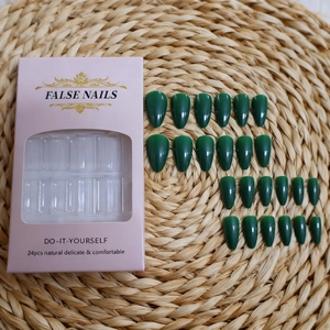 Detail of dark green almond false nail kit with 24 glossy pieces in pink window packaging