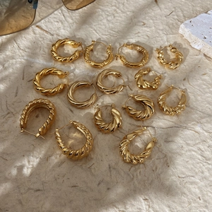 Chunky gold-plated stainless steel twisted hoop earrings in various sizes for women