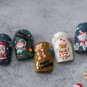Christmas 5D embossed nail stickers featuring Santa, gingerbread man and bear patterns