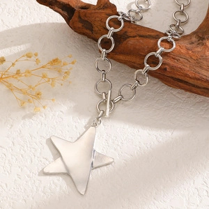 Detailed view of silver star pendant with textured link chain and T-bar toggle clasp