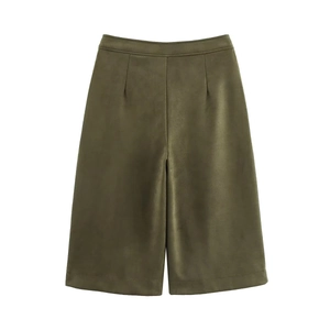 Detailed close-up of olive green faux suede Bermuda shorts with matte velvet texture