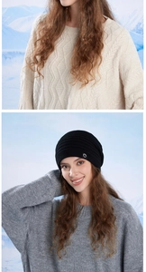 Detail of black knit beanie featuring premium texture and small circular side emblem