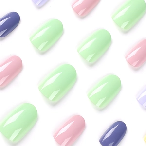 Glossy press-on nails in pastel green pink purple and blue with squoval shape design