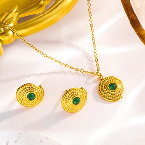 Golden vintage necklace and stud earrings set with green stone and spiral pendant