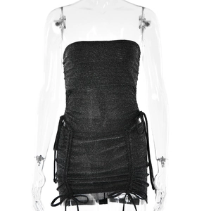 Detail of black sequined tube top mini dress featuring side drawstring and ruched texture