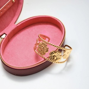18K gold-plated stainless steel hollow floral cuff bracelet in a pink velvet jewelry box