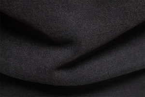 Macro texture of charcoal grey thick fleece lining on the standing collar sweatshirt