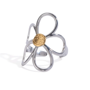 Two-tone stainless steel open ring featuring a hollow flower design and hammered gold center