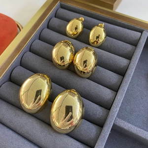Minimalist gold plated oval stud earrings set in small medium and large sizes