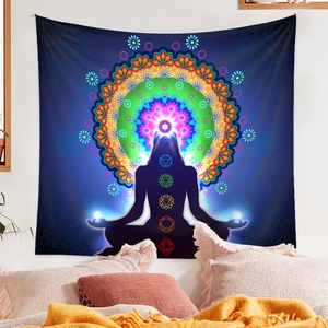 Detail view of a yoga meditation tapestry with mandala patterns and chakra symbols