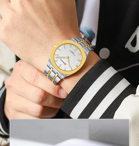 Close-up of a men's ultra-thin square quartz watch with a two-tone gold and silver band