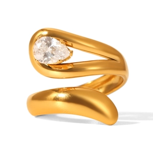 Detailed close-up of a pear-cut gemstone set in a spiral gold plated stainless steel ring