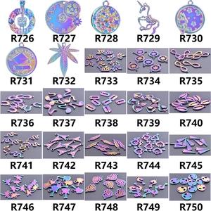 Detailed grid of 25 crystal teardrop and angel wing alloy pendants in colorful finishes