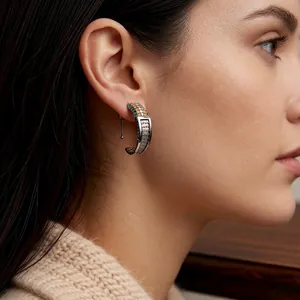 Vintage silver C-hoop earrings with tricolor zircon inlays on elegant model's ear