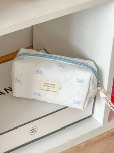 Quilted white cosmetic bag with blue bow prints and high-capacity storage design