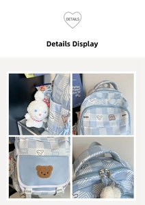 Detailed close-up of light blue plaid backpack with cute bear prints and rabbit charm
