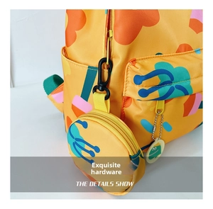 Detail showing high-quality zipper and hardware on a yellow floral pattern kids backpack