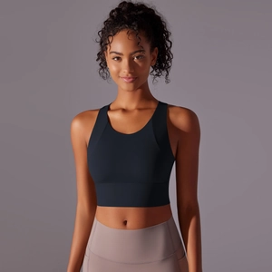 Detail of the racerback sports bra and high-waisted yoga leggings on model