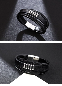 Macro shot of multi-layer braided black leather bracelet with silver magnetic buckle