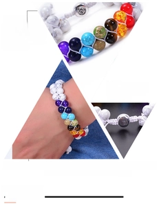 Macro view of double-layer woven bracelet with healing natural stones and Om charm metal clasp