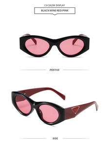 Detail of cat-eye sunglasses with pink lenses and wine red temples with metal logo