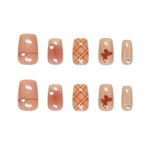 Handmade cat eye press-on nails with plaid patterns and glitter bow designs