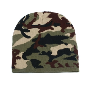 Detailed knit texture of jungle camouflage winter beanie with green and brown patterns