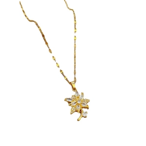 Luxurious gold flower pendant necklace with clear zircon stones on a flat link chain