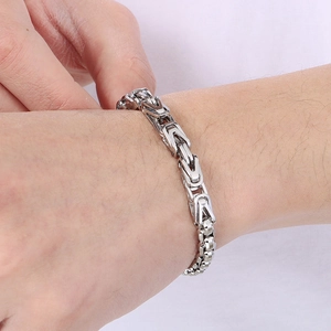 Silver Byzantine V-shape stainless steel bracelet for men on wrist, hip-hop style