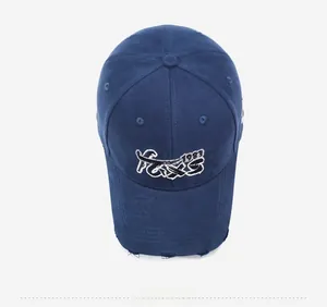 Detailed view of navy baseball cap featuring 1983 embroidery and distressed brim details