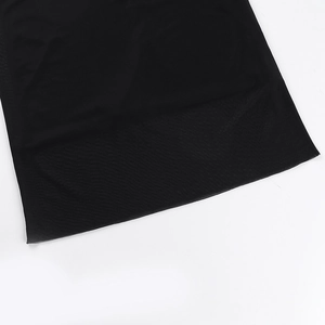 Close-up of black mesh fabric showing breathable texture and fine edge stitching details