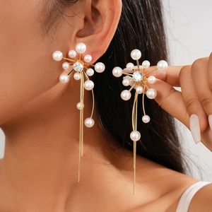 Elegant gold flower tassel earrings with white pearls and sparkling cubic zirconia for women