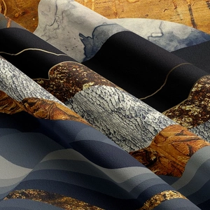 Detailed macro view showing the thick fabric texture and abstract mountain print of the tapestry