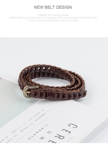 Detail of dark brown braided belt with a vintage bronze buckle on a stylish lifestyle background