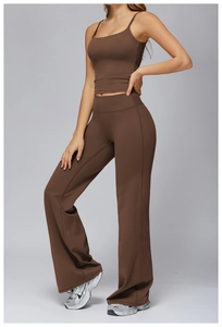 Detail of high-waist flared sports trousers and slim strap top in dark brown