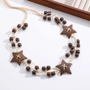 Bohemian braided waist chain with round wood beads and star pendants on white background