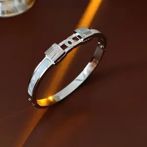 Titanium steel T-shaped open bangle with sparkling cubic zirconia and white shell inlay