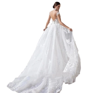 Elegant white lace mermaid wedding dress with V-neck, open back, and long royal train