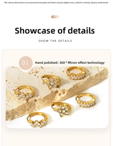 Detailed macro view of 18K gold plated zircon hoops with star and V-shaped patterns