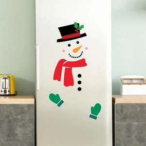 Detailed view of DIY snowman magnetic decals set on a stainless steel refrigerator door