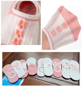 Detail of breathable mesh cotton low cut socks with floral and peach patterns